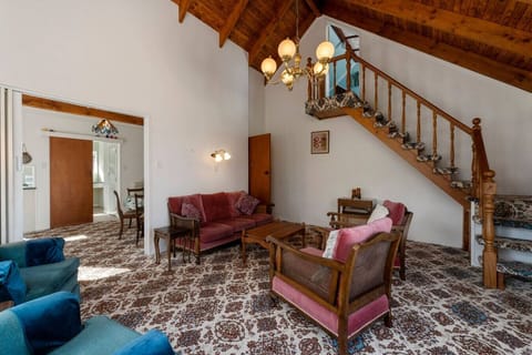 Lounge with stairs leading to the 4th bedroom