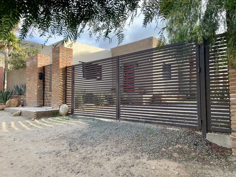 Gated house with ring security camera.