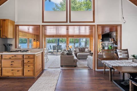 View from kitchen area into living room with full view of the lake