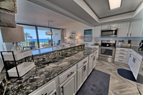 Spacious updated kitchen with all new stainless steel appliances is perfect for preparing meals 