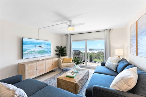 Stylish living room with modern coastal decor and balcony access.Stylish living room with modern coastal decor and access to your spacious private balcony