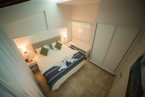 Apartment, 1 Bedroom, Sea View | 1 bedroom, blackout drapes, iron/ironing board (on request), WiFi (free)