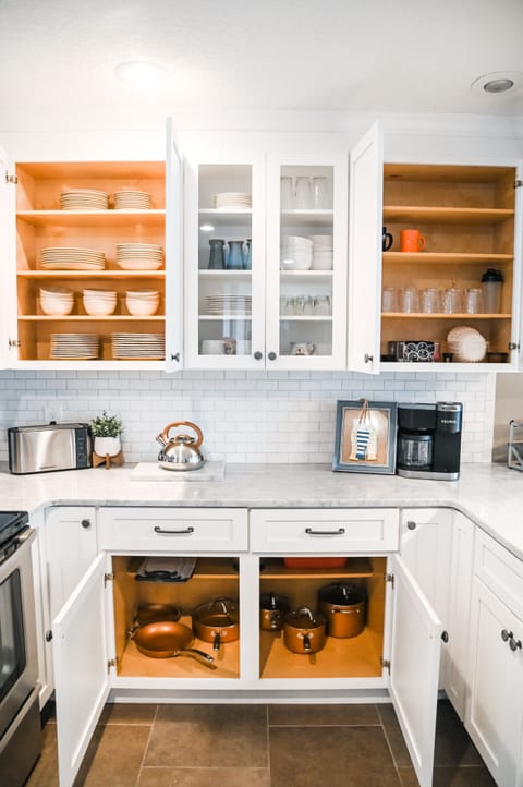 Full kitchen stocked with all the essentials to serve food and drinks.