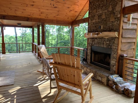 Exterior fireplace on main living level deck.
