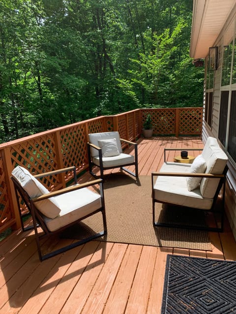 Upper back porch area : plenty of seating with a view of the forest