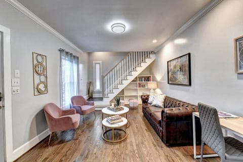 Cozy living room with ample seating, inviting ambiance, and abundant natural light—perfect for relaxing and unwinding.