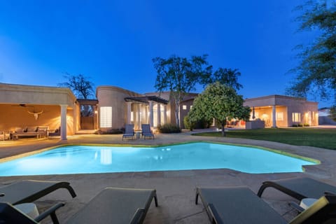 Your private resort—poolside paradise under desert skies.