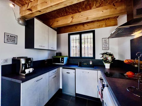 equipped kitchen and its Delonghi espresso grinder coffee maker