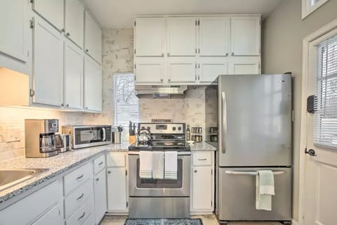 The kitchen has everything. Fully stocked with utensils, dishes, spice rack.