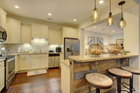 A full equipped kitchen with new appliances perfect for making a gourmet meal.