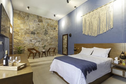 Enjoy the suite room with a delicious wine.