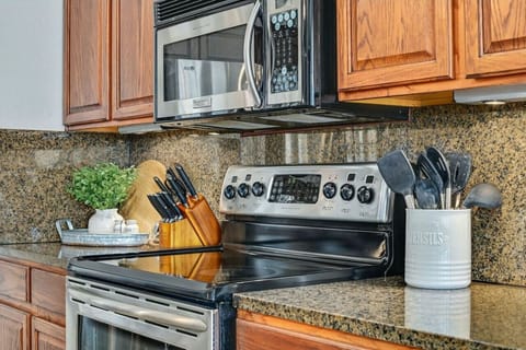 Prepare home-cooked favorites with ease—fully equipped kitchen features stainless appliances, granite counters, and everything you need for a Texas feast.