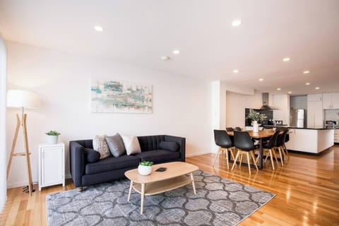 Get comfortable on the sofa. A large wall-mounted TV caters to your evening entertainment.