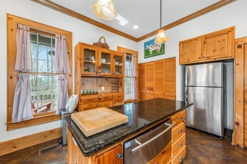 Plenty of spices, dishes, pots, pans, and appliances needed to prepare meals.