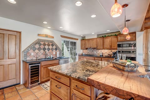 Natural Edge Granite Counters and a Wine Fridge