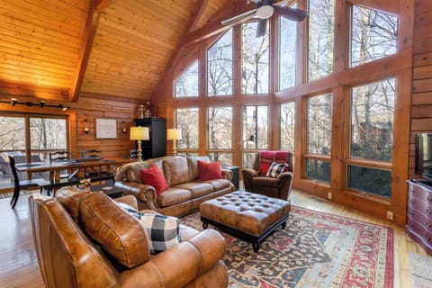 Stoney Brook Cabin Great Room with Wood Floors, Vaulted Ceilings, Wall of Windows Framing Mountain Views!
