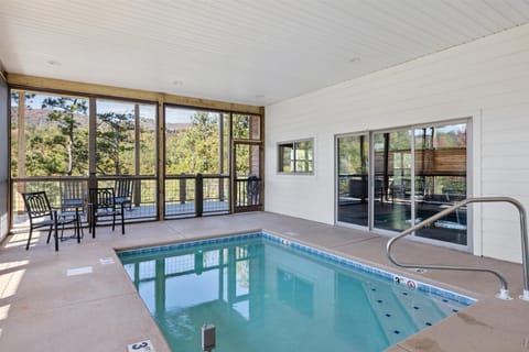 The indoor pool is heated to 86 degrees year round. During the winter months, clear vinyl panels are installed over the screened areas to help retain the warmth and maintain a comfortable swimming environment.