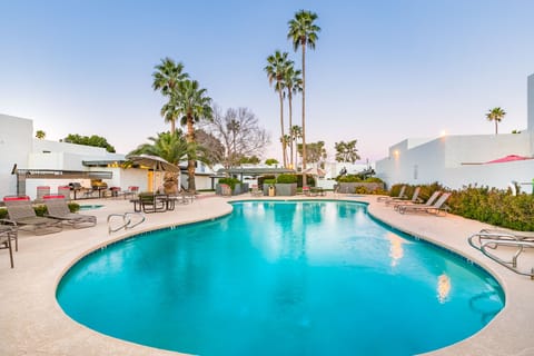Relaxing pool with plenty of lounge chairs.