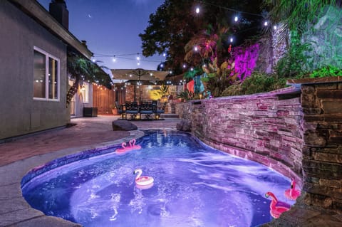 Unwind in the spa under the stars and lights after a day of adventure
