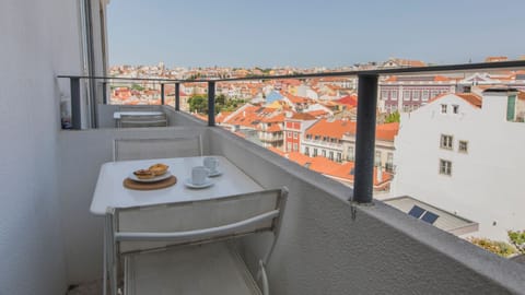 The perfect spot for a cup of coffee or an intimate dinner with a view! #airbnb #airbnblisbon #portugal #pt #lisbon #balcony #city #view