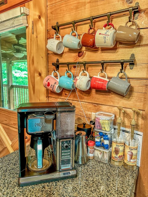 Ninja coffee maker and complimentary coffee bar.