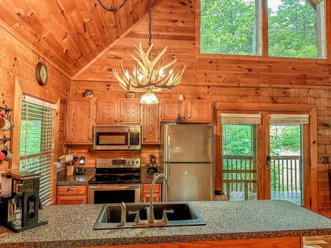 Kitchen with coffee maker, waffle maker, air fryer, crock pot, blender and more.