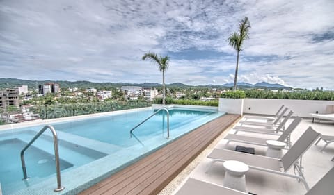 Shared rooftop pool & grill area