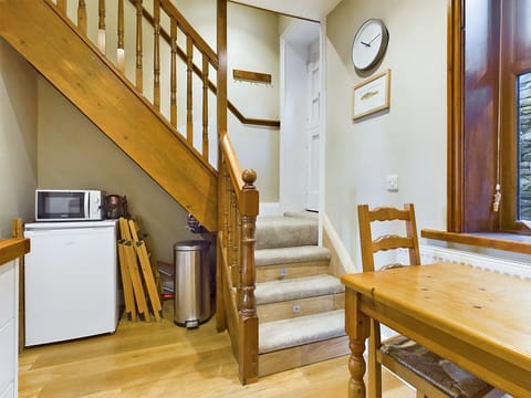 View from Kitchen to stairs and back door