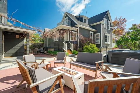 Sunny patio made for gathering—share meals at the wood table, then lounge on the outdoor sectional around the low coffee table as string lights sparkle above.