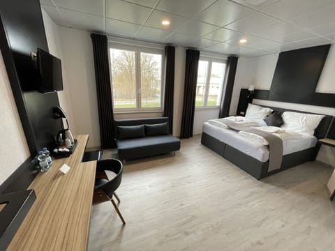 Family Room | Premium bedding, laptop workspace, soundproofing, travel crib