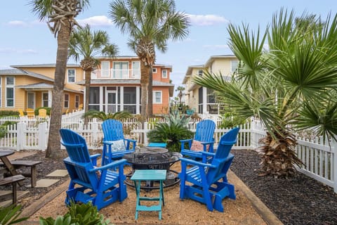 Cozy outdoor fire pit area with colorful seating for family gatherings.