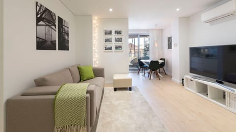 A spacious and stylish living room w/ AC and a TV #airbnb #airbnbporto #portugal #pt #porto