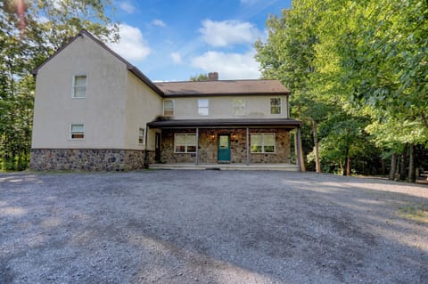 front of the house. in a wooded, private setting
