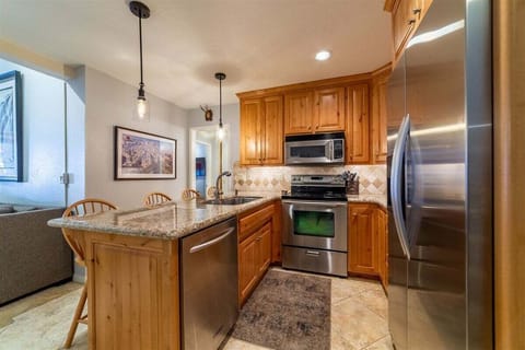 Fully Equipped Kitchen with Additional Bar Seating