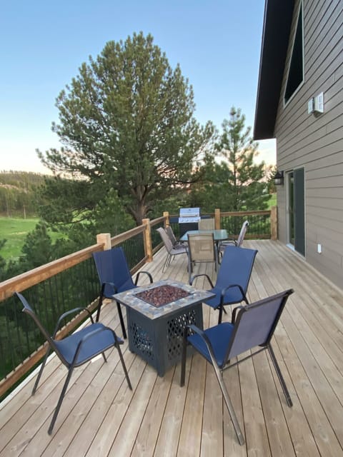 Plenty of seating on the patio with fire pit and new grill.  