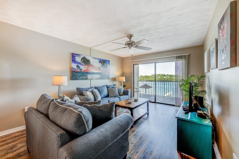 Living Room with Balcony Access and Water Views