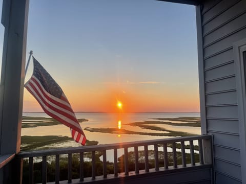 The sun sets directly across the bay all summer long!