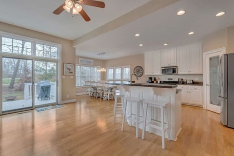 Large kitchen and dining area with a beautiful view of the golf course and mountains.
