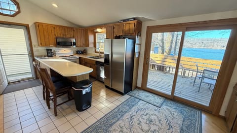Kitchen with dishwasher, fridge, oven, microwave