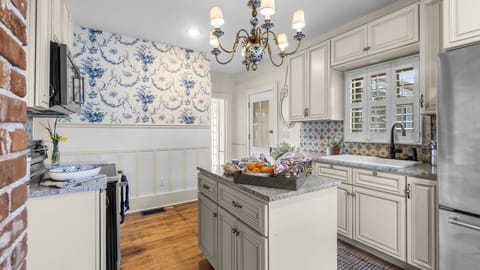 Dutch Delft influence in the Kitchen overlooking a garden out back.