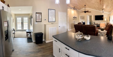 View of the back entryway and the Living Room from the Kitchen Sink