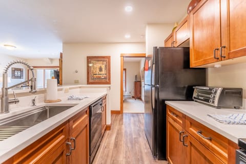 Fully stocked kitchen featuring granite counter tops.