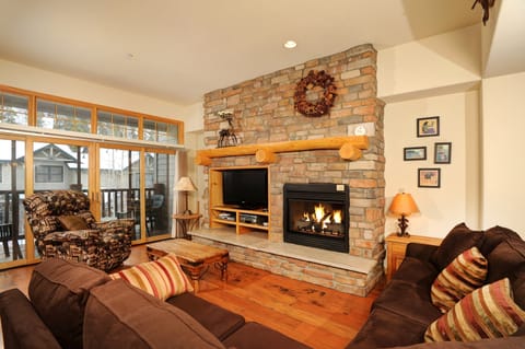 Relax in the cozy living area, complete with fireplace