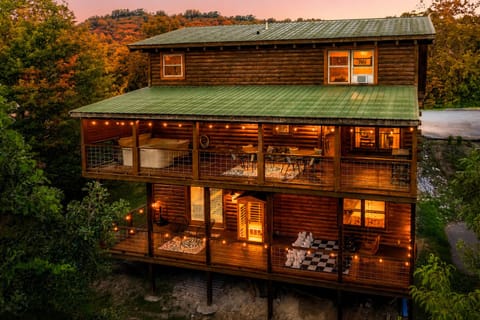 Our 3 story cabin features 2 decks with hot tub, sauna, and games.