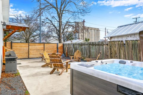 Private hot tub in enclosed back yard.
