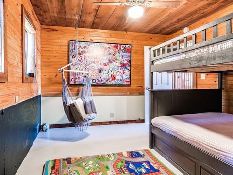 FULL over FULL bunk beds with twin trundle. Chalk bord wall. Roll out crib