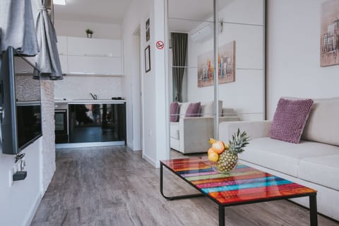 Deluxe Studio, Non Smoking, Pool Access | Living area | 45-inch flat-screen TV with satellite channels, TV