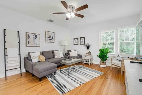 Step into our spacious living room—a haven of historic charm. The wooden floors whisper stories of days gone by, while chic decor adds a contemporary twist. Gather with friends, sink into comfort, and let time slow down.