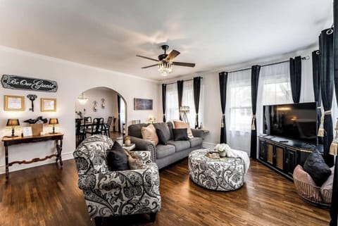 Walk in the front door to the glamorous living room, complete with 55" Smart TV, comfy seating, desk and welcome table!