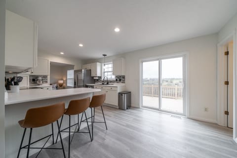 The kitchen is clean, open, and has room for the whole family!